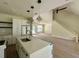 Modern kitchen featuring quartz countertops, stainless steel appliances, eat-in island, and bright lighting at 335 Ruth Blvd, Longwood, FL 32750