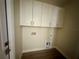 Practical laundry room with overhead cabinets and utility connections at 335 Ruth Blvd, Longwood, FL 32750