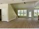 Bright and airy living room featuring hardwood floors, neutral paint, and abundant natural light from the windows at 335 Ruth Blvd, Longwood, FL 32750