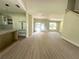 Spacious living room with hardwood floors, new kitchen, and natural light at 335 Ruth Blvd, Longwood, FL 32750