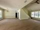 Open living area with a staircase, modern lighting, and ample natural light at 335 Ruth Blvd, Longwood, FL 32750