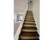Staircase between floors that features a white wall and railing at 335 Ruth Blvd, Longwood, FL 32750