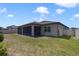 Beautiful backyard with a screened-in patio and well-maintained grass at 3629 Vega Creek Dr, St Cloud, FL 34772