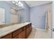 Bathroom featuring blue walls, granite countertops, single sink, toilet, and bathtub at 3629 Vega Creek Dr, St Cloud, FL 34772