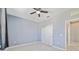 Bedroom with light blue walls, ceiling fan, and closet at 3629 Vega Creek Dr, St Cloud, FL 34772