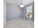 The dining room offers ample sunlight from the window and a modern light fixture at 3629 Vega Creek Dr, St Cloud, FL 34772