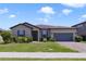 Charming single-story home with a two car garage, well-manicured lawn, and inviting curb appeal at 3629 Vega Creek Dr, St Cloud, FL 34772