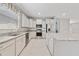 Modern eat-in kitchen features stainless steel appliances, stylish backsplash, and granite countertops at 3629 Vega Creek Dr, St Cloud, FL 34772