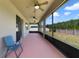 Screened in patio with ceiling fans and outdoor seating area at 3629 Vega Creek Dr, St Cloud, FL 34772