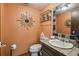 Small bathroom featuring a sink with decorative tiling and unique wall decorations at 383 Brushwood Ln, Winter Springs, FL 32708