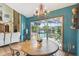Dining room featuring sliding glass doors and a view of the pool and backyard at 383 Brushwood Ln, Winter Springs, FL 32708