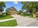 Inviting two-story home with an attached two-car garage and a meticulously manicured front yard at 383 Brushwood Ln, Winter Springs, FL 32708