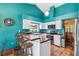 Bright kitchen featuring white cabinets, butcher block countertops, and terracotta tile flooring at 383 Brushwood Ln, Winter Springs, FL 32708