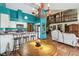 Open kitchen with a breakfast bar, dining area, and a view of the living room and upper level at 383 Brushwood Ln, Winter Springs, FL 32708