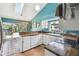 Bright kitchen boasts butcher block countertops and a large window overlooking the backyard at 383 Brushwood Ln, Winter Springs, FL 32708