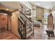 Spacious living room with a soaring ceiling, brick fireplace, and staircase to the upper level at 383 Brushwood Ln, Winter Springs, FL 32708
