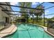 Screened pool with a jacuzzi, surrounded by landscaping providing privacy and relaxation at 383 Brushwood Ln, Winter Springs, FL 32708