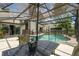 Poolside patio featuring an umbrella, dining table set, and views of the serene backyard at 383 Brushwood Ln, Winter Springs, FL 32708