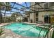 The screened-in pool is surrounded by a patio, offering a great space for outdoor entertaining at 383 Brushwood Ln, Winter Springs, FL 32708