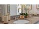 Bathroom featuring double sinks, granite countertops, and decorative accents creating an inviting and functional space at 3896 Diving Dove Ln, Bartow, FL 33830