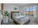 Cozy bedroom featuring a comfortable bed and accent decor complemented by natural light and views at 3896 Diving Dove Ln, Bartow, FL 33830