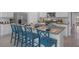 Stylish kitchen island with granite countertop, bar stool seating, and modern appliances in an open layout at 3896 Diving Dove Ln, Bartow, FL 33830