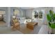 Bright living room featuring a comfortable white sofa, stylish decor, and lots of natural light at 3896 Diving Dove Ln, Bartow, FL 33830