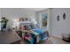Charming bedroom with colorful surf decor, comfortable bed, and ample natural light creates a vibrant space at 3908 Diving Dove Ln, Bartow, FL 33830