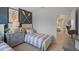 Well-decorated bedroom with a single bed, blue accent wall with crossed oars, and matching bedside tables at 3908 Diving Dove Ln, Bartow, FL 33830