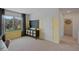 View of a study room featuring a blackboard, a cabinet with woven baskets, yellow accent wall and a window with outdoor views at 3908 Diving Dove Ln, Bartow, FL 33830