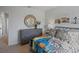 Charming bedroom with colorful surf decor, comfortable bed, and ample natural light creates a vibrant space at 3908 Diving Dove Ln, Bartow, FL 33830