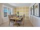 Bright dining room featuring a wooden table with seating for eight, plus stylish decor at 3908 Diving Dove Ln, Bartow, FL 33830