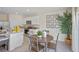 Bright, modern kitchen features stainless appliances, granite countertops, breakfast nook, and decor at 3908 Diving Dove Ln, Bartow, FL 33830