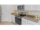 Bright, modern kitchen features stainless steel appliances and granite countertops for cooking at 3908 Diving Dove Ln, Bartow, FL 33830