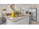 Open kitchen island with stainless steel sink and seating, perfect for entertaining and daily living at 3908 Diving Dove Ln, Bartow, FL 33830