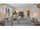 Bright living room featuring comfortable seating and natural light, creating a welcoming atmosphere at 3908 Diving Dove Ln, Bartow, FL 33830