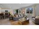 Bright living room featuring a modern sofa, stylish rug, and view of the outdoor space, great for relaxation at 3908 Diving Dove Ln, Bartow, FL 33830