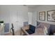 Well-lit office space featuring a desk with a laptop, ideal for remote work or study, and a sitting area at 3908 Diving Dove Ln, Bartow, FL 33830