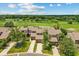 An aerial view of townhomes with well-manicured lawns at 3928 Villas Green Cir, Longwood, FL 32779
