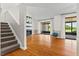 Open floor plan with a fireplace and sliding door to the patio at 3928 Villas Green Cir, Longwood, FL 32779
