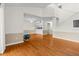 Spacious living area with hardwood floors, open floor plan, and access to the kitchen at 3928 Villas Green Cir, Longwood, FL 32779