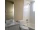 Bathroom with white tiled shower and tub combination, sink, and mirror at 410 Horizon Dr, Winter Springs, FL 32708