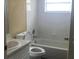 Bathroom with white tile, a shower and tub combo, and a single sink vanity at 410 Horizon Dr, Winter Springs, FL 32708