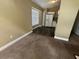 Kitchen flows from the carpeted living room and offers white appliances and abundant light from an adjacent window at 410 Horizon Dr, Winter Springs, FL 32708