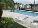 A community pool with lounge chairs invites relaxation and recreation at 410 Horizon Dr, Winter Springs, FL 32708