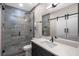 This bathroom offers a seamless glass shower, modern hardware, and a bright, spacious vanity at 5108 Sailwind Cir, Orlando, FL 32810