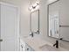 This bathroom features double sinks and a large mirror, combining style and functionality at 5108 Sailwind Cir, Orlando, FL 32810