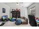 This bedroom has a comfy couch and desk, perfect for relaxing or studying at 5108 Sailwind Cir, Orlando, FL 32810