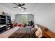 Spacious bedroom with a ceiling fan, closet and a desk; a great space for work and play at 5108 Sailwind Cir, Orlando, FL 32810