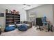 This bedroom offers a great place to relax or study, with a window for natural light at 5108 Sailwind Cir, Orlando, FL 32810